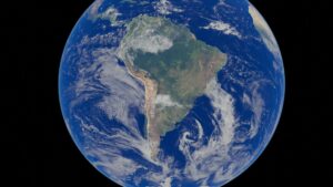 Stunning satellite image of Earth focusing on the South American continent with clear blue oceans visible.